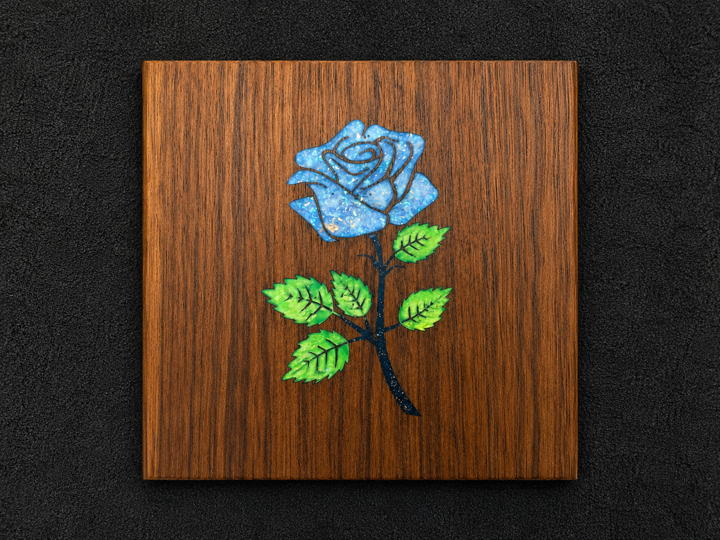 Blue rose polymer clay inlay on a wood panel
