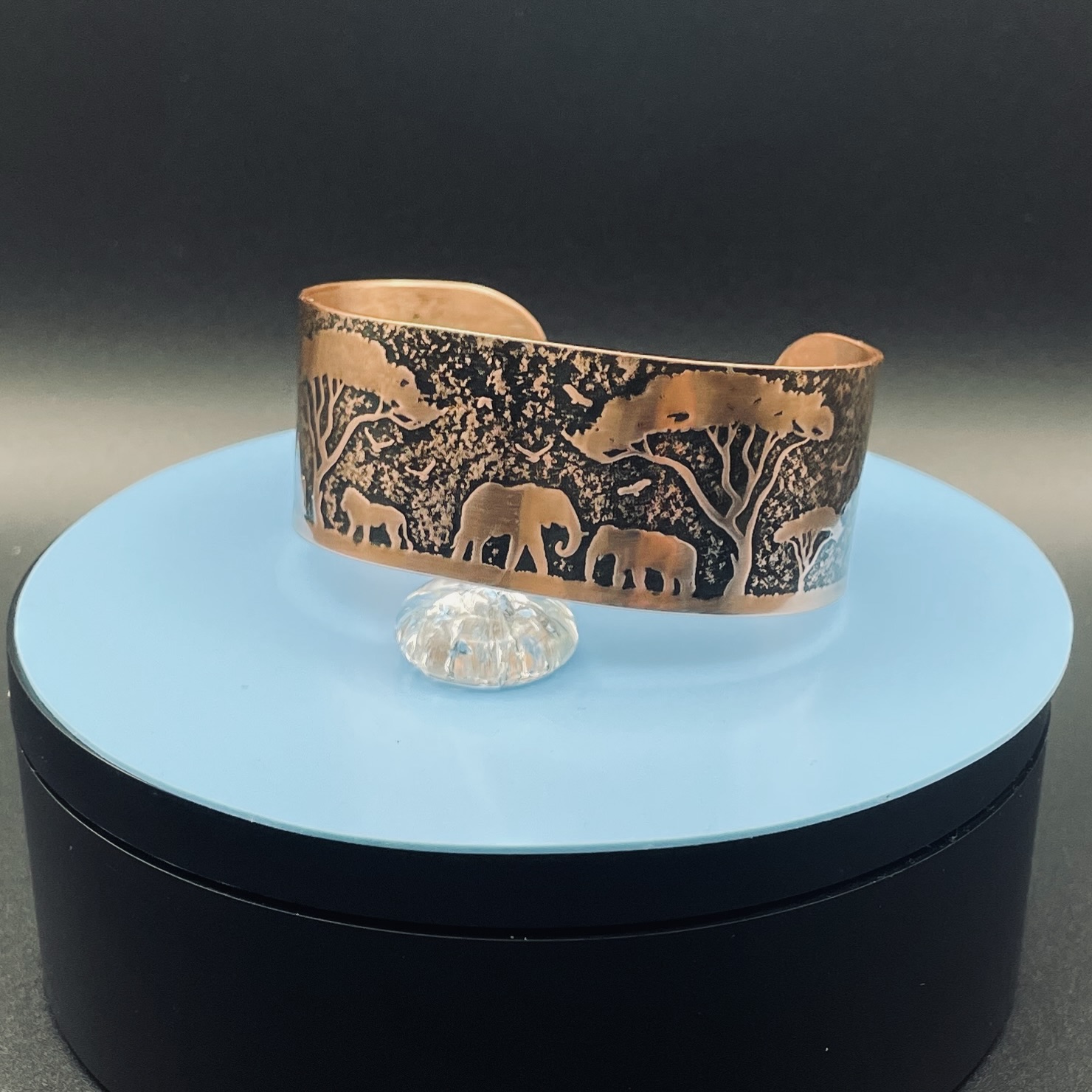 Embossed copper cuff bracelet with African animal design