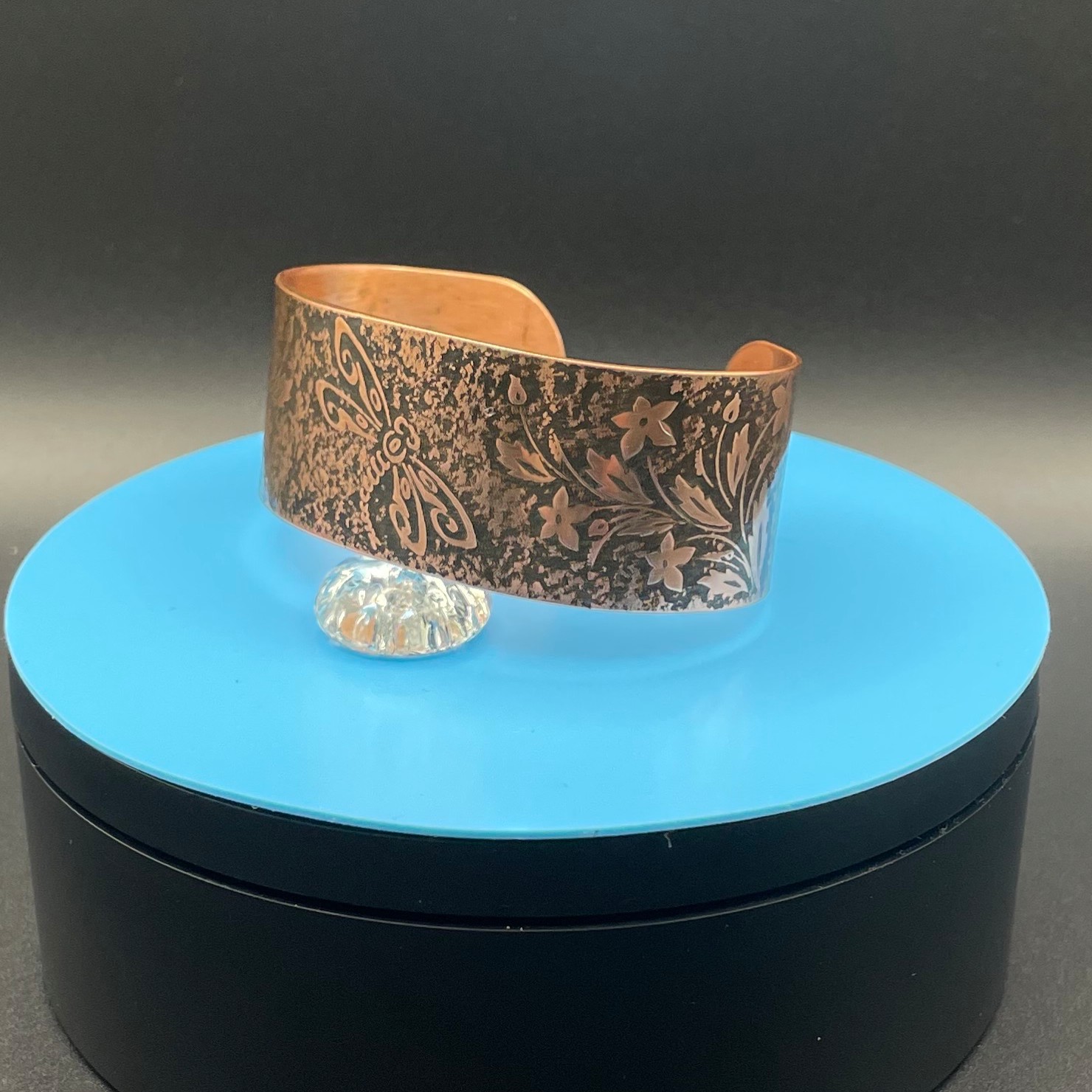 Embossed copper cuff bracelet with dragonfly pattern