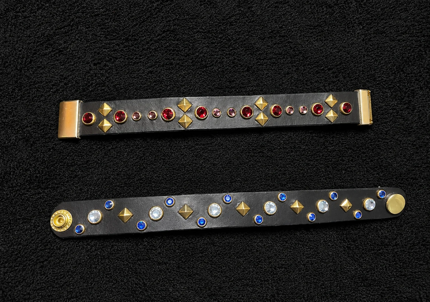 Two leather bracelets with colored crystals and metal accents