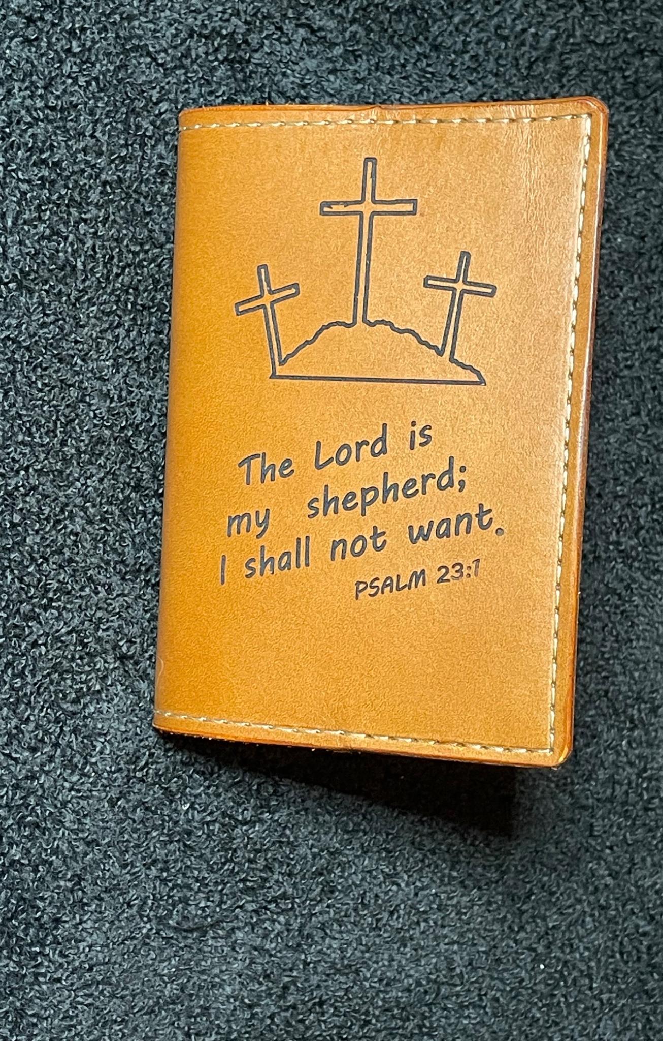 Small tan leather notebook engraved with three crosses and Psalm 23 text