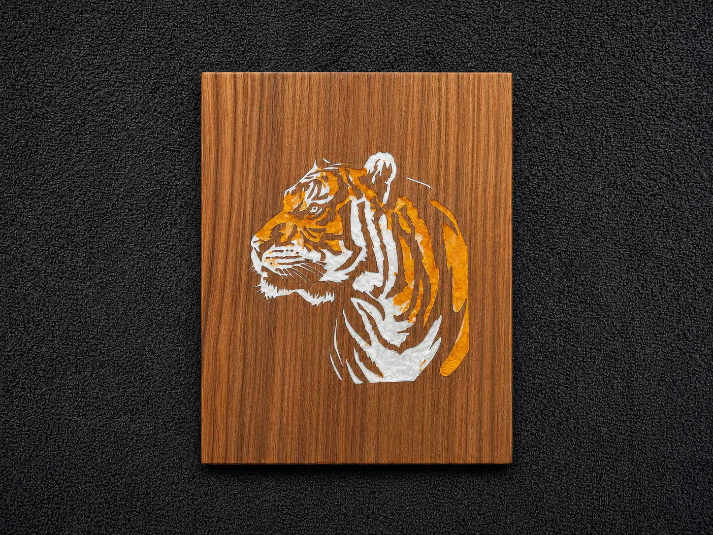 Tiger polymer clay inlay on a wood panel